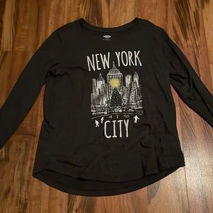A long sleeve shirt that says “New York City”, girls L, from Old Navy.